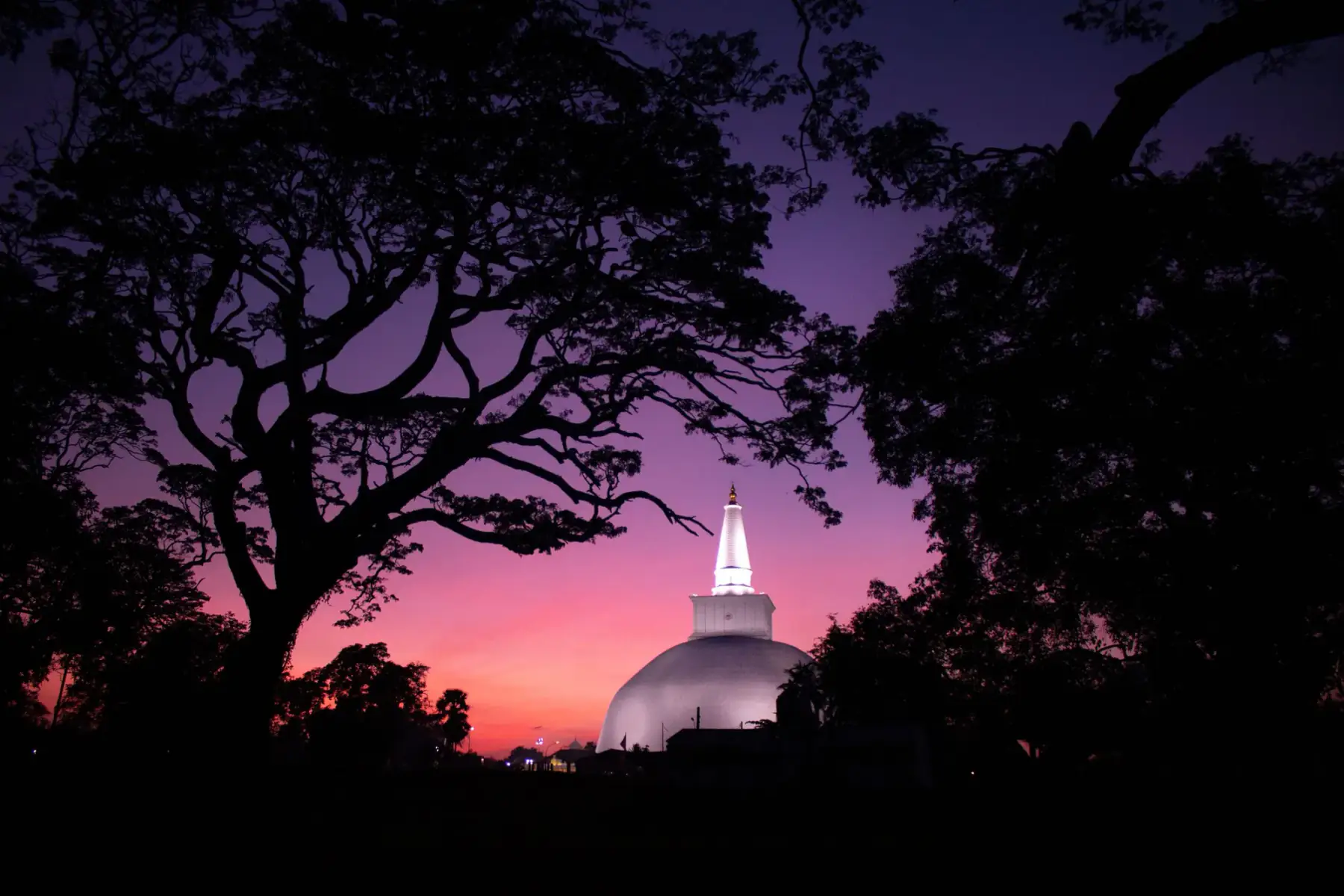 The white dome of Ruwanwelisaya stupa at twilight, Anuradhapura.