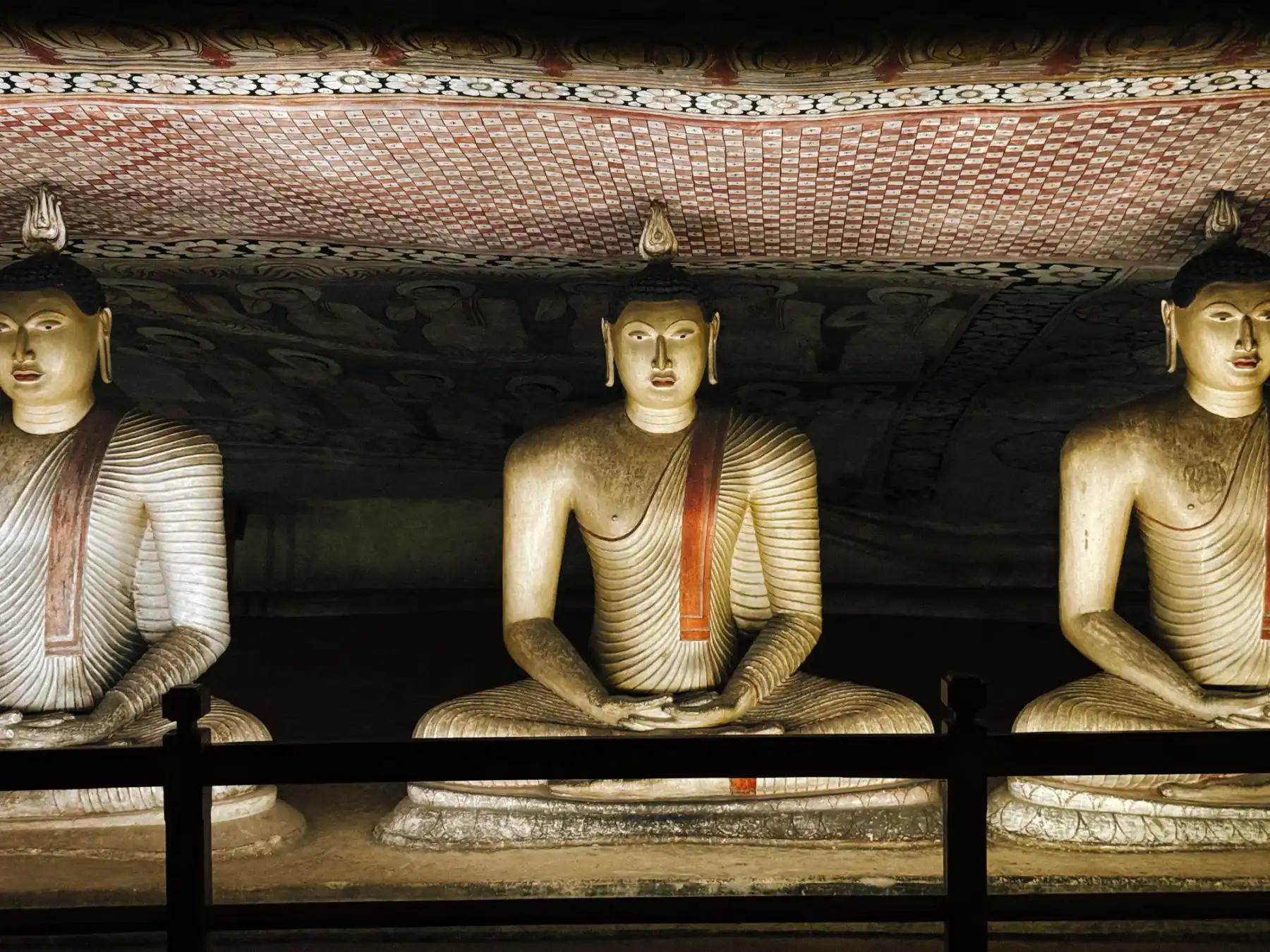 Rows of Buddha statues inside the Dambulla cave temple.