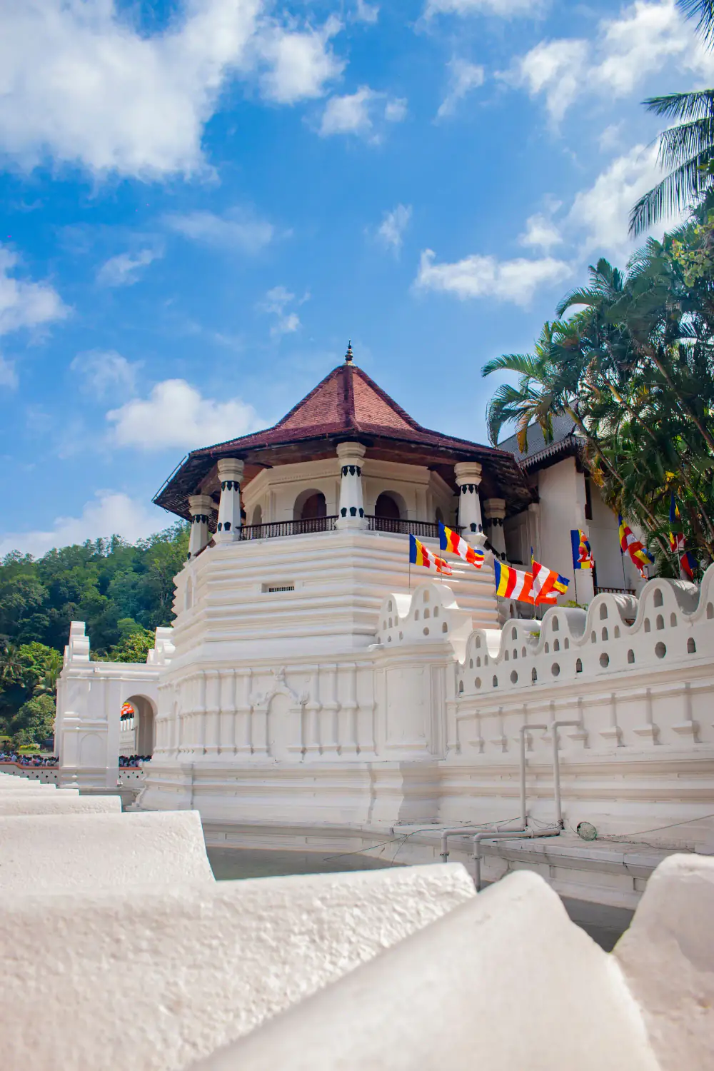 The Temple of the Sacred Tooth Relic in Kandy, strung with prayer flags.
